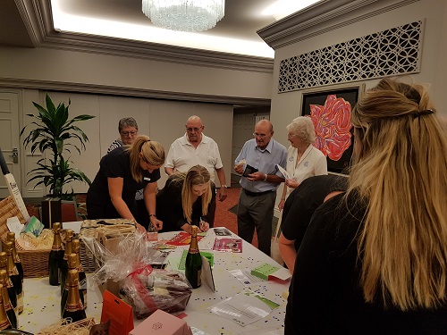 People queuing at the raffle table