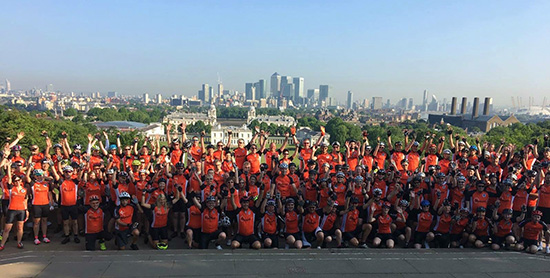 Large group of people at Greenwich all wearing orange Myeloma UK t-shirts